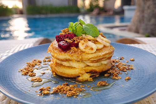 Breakfast pancakes by the pool