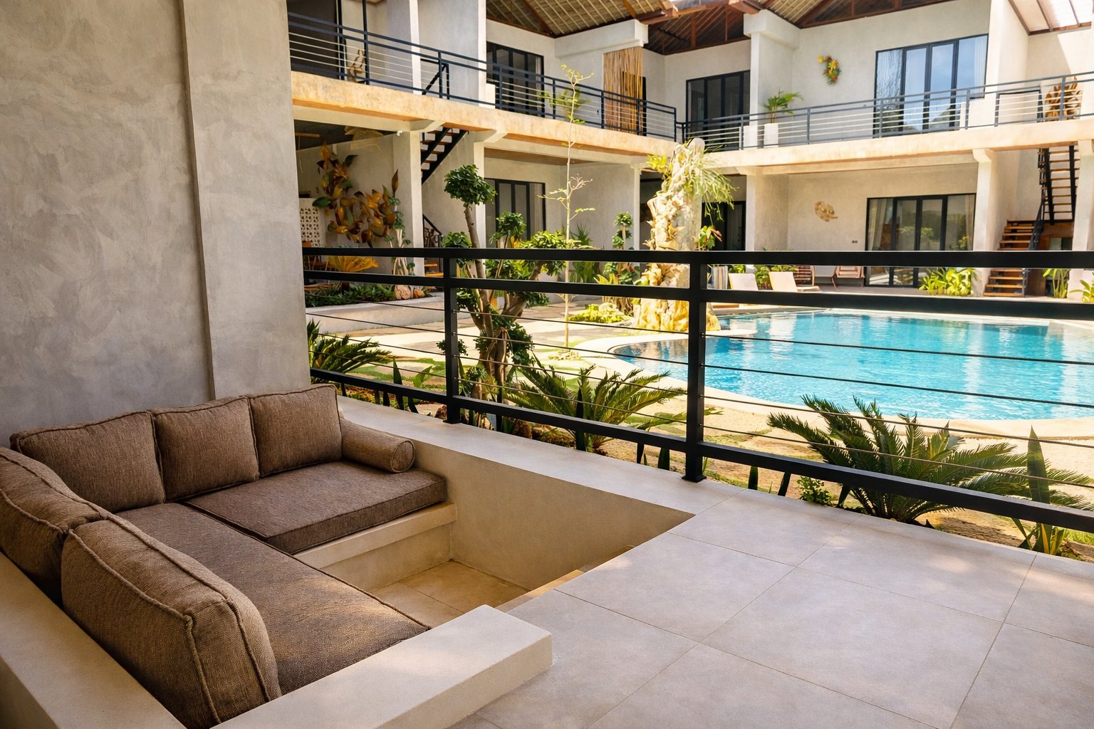 Deluxe room sunken sofa with pool view at Bella Vida Resort Uluwatu